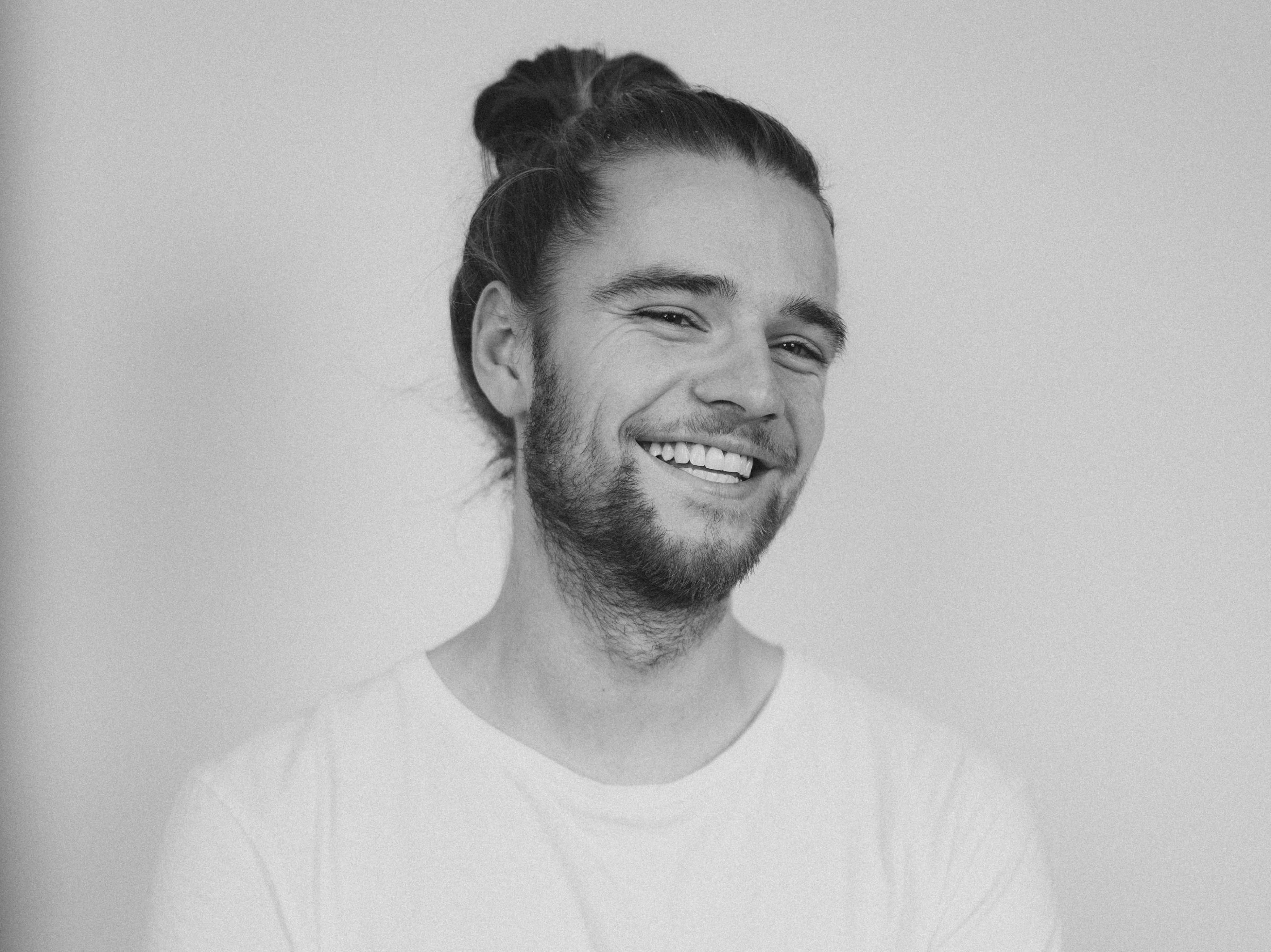 Picture of man with beard and ponytail