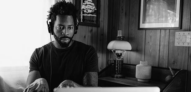 Bearded man playing piano