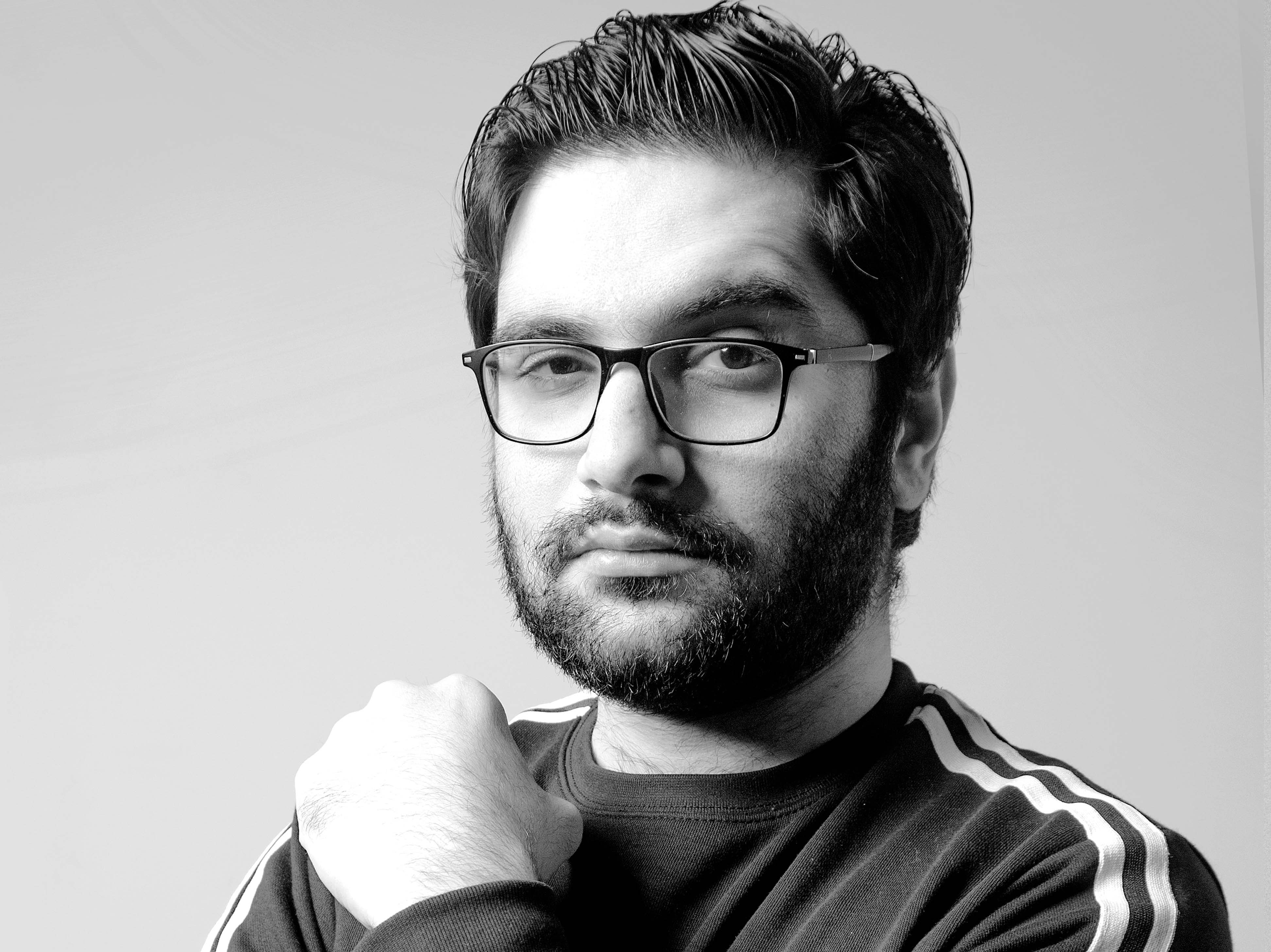 Picture of bearded intellectual man with hand under chin